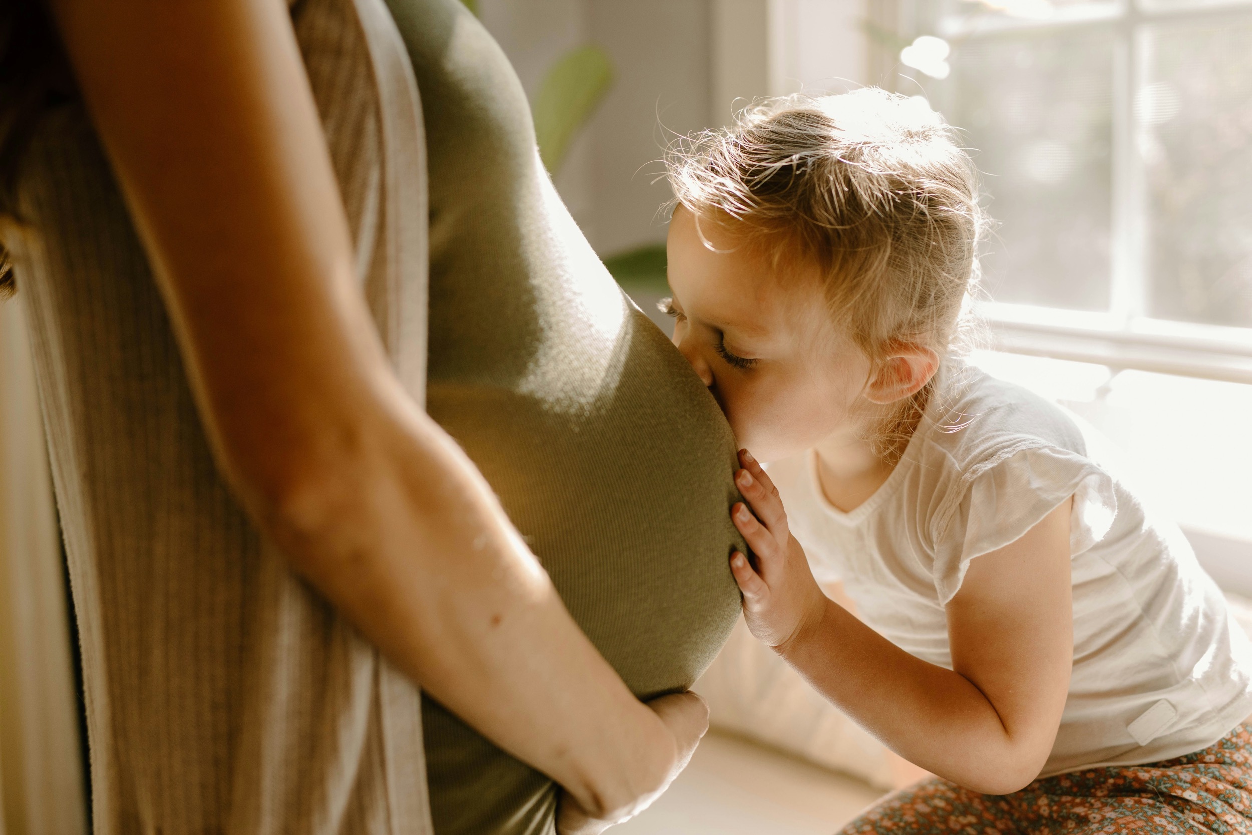 Baby Kissing Mommys Belly Teresitas Nest Sleep Coach 1